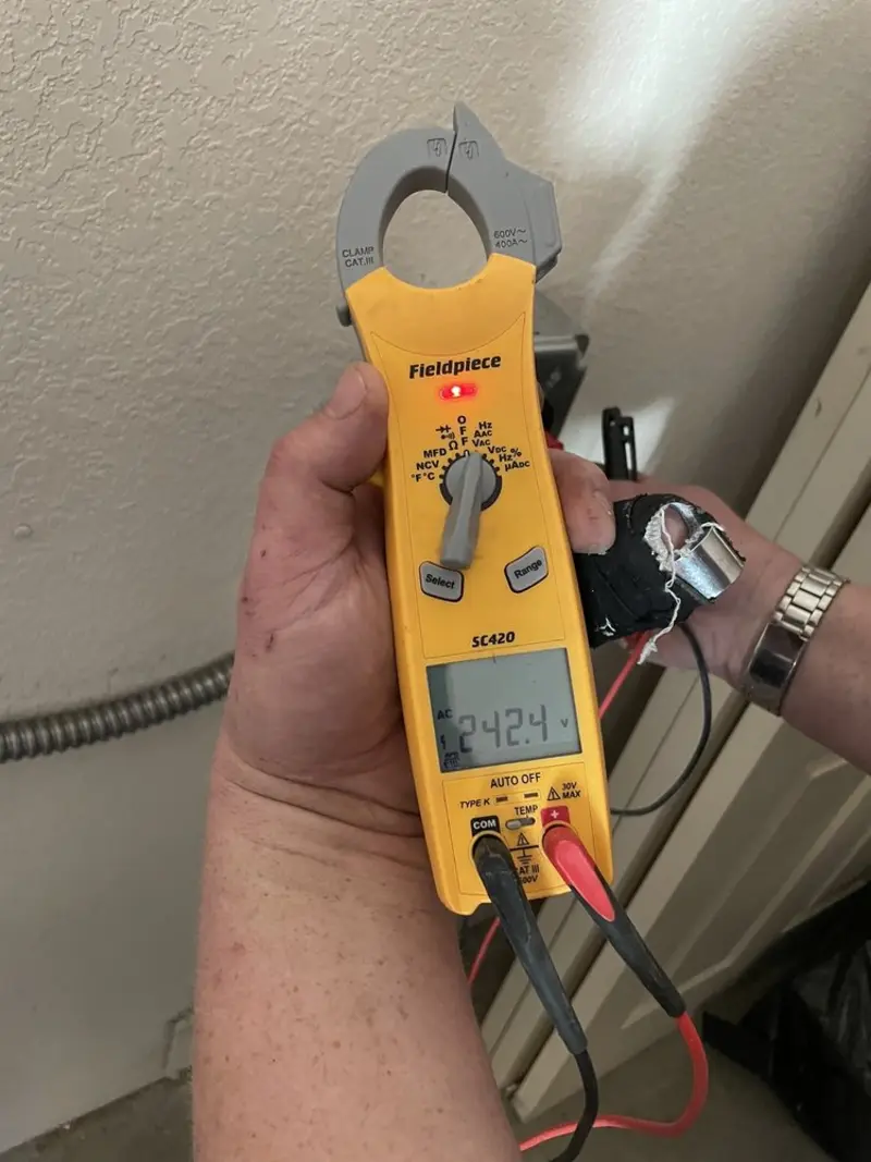 Voltage testing with clamp meter during Recessed Lighting Installation in Portland